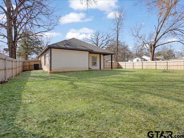 view of yard with a fenced backyard and cooling unit