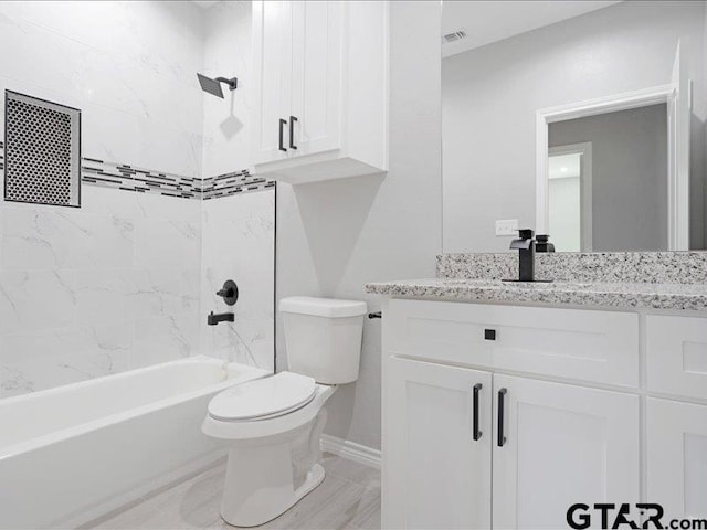 full bath featuring toilet, visible vents, vanity, baseboards, and shower / bathing tub combination