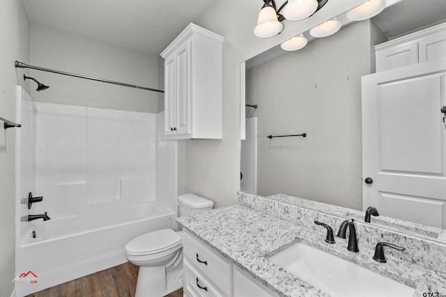 full bathroom featuring  shower combination, wood-type flooring, vanity, and toilet