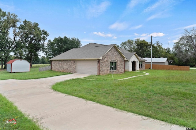 view of front of house featuring a garage and a front yard