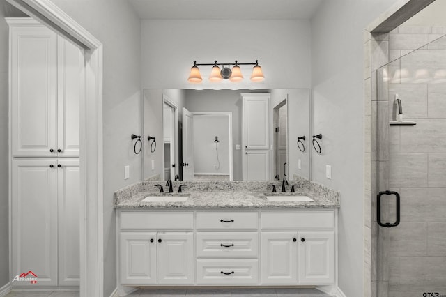 bathroom featuring vanity, an enclosed shower, and tile patterned flooring