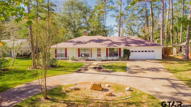 ranch-style house with a porch, a garage, and a front yard