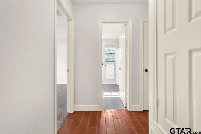 corridor featuring hardwood / wood-style flooring