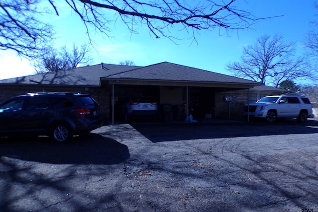 view of side of home featuring a garage