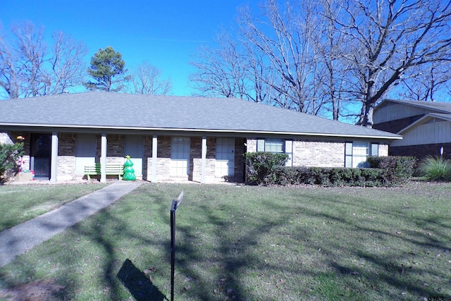 ranch-style home with a porch and a front lawn