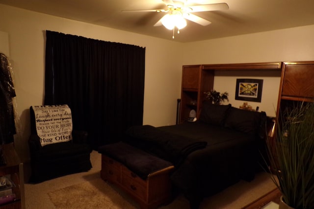 bedroom featuring ceiling fan and carpet floors