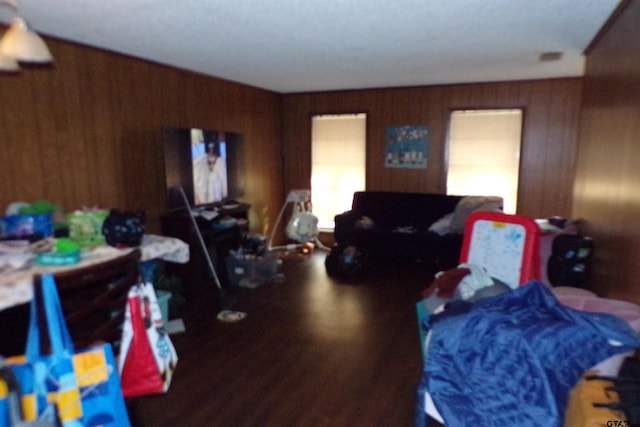 bedroom with wood walls