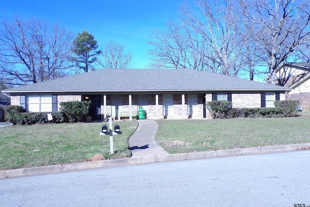 single story home featuring a front yard