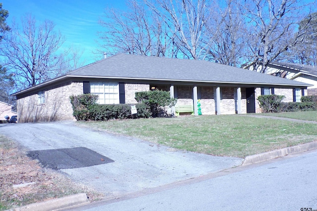 ranch-style home with a front yard