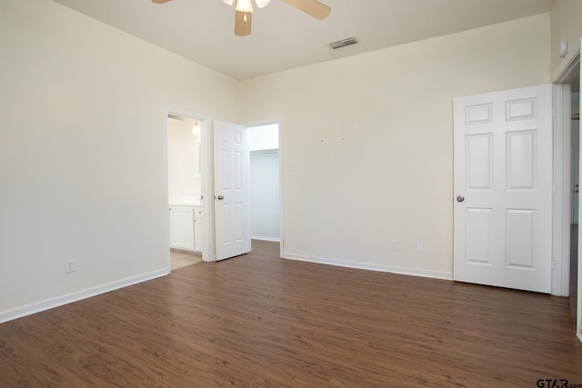 16530 Echo Glen Dr, Tyler, TX 75703 - empty room with a ceiling fan, dark wood-type flooring, and baseboards