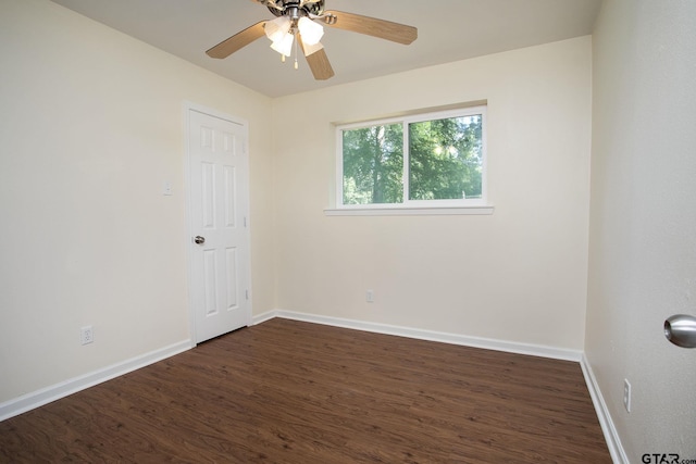 16530 Echo Glen Dr, Tyler, TX 75703 - spare room with dark wood-type flooring, baseboards, and a ceiling fan