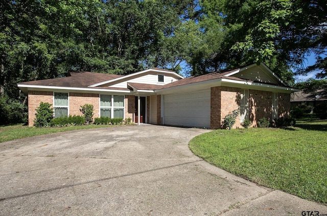 16530 Echo Glen Dr, Tyler, TX 75703 - ranch-style house featuring brick siding, an attached garage, concrete driveway, and a front lawn