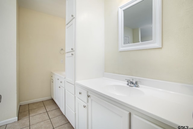 16530 Echo Glen Dr, Tyler, TX 75703 - bathroom featuring double vanity, tile patterned floors, and baseboards
