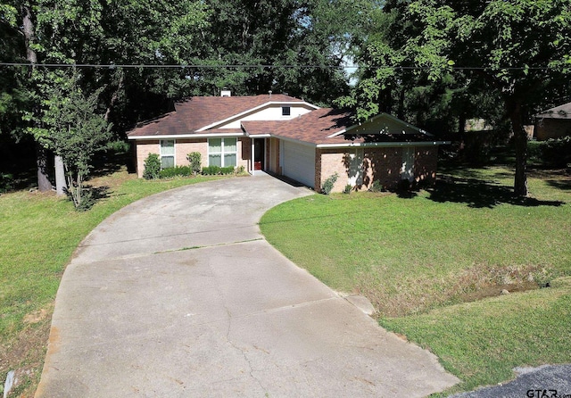 16530 Echo Glen Dr, Tyler, TX 75703 - view of front of home with driveway, a front yard, a garage, and brick siding