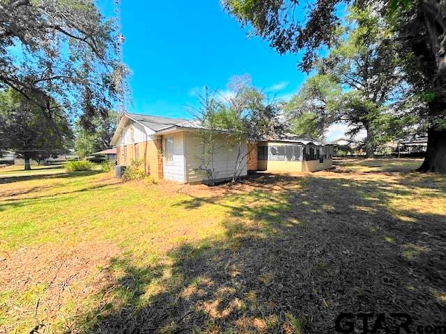 view of property exterior featuring a yard