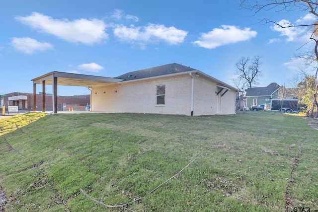 rear view of house with a yard