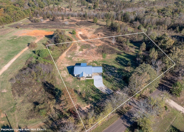 birds eye view of property with a rural view