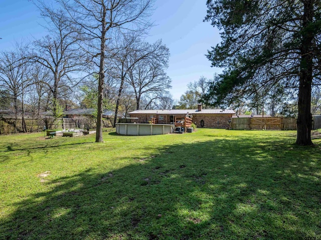 view of yard featuring a fenced backyard and a fenced in pool