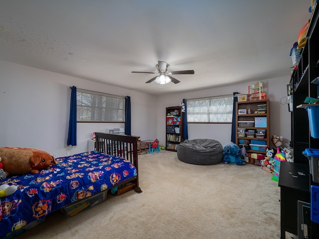 bedroom featuring a ceiling fan and carpet floors