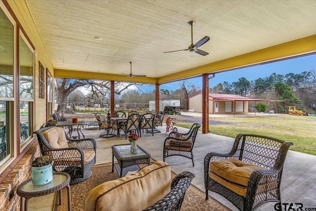 view of patio / terrace featuring outdoor dining space, a playground, a ceiling fan, and an outdoor hangout area