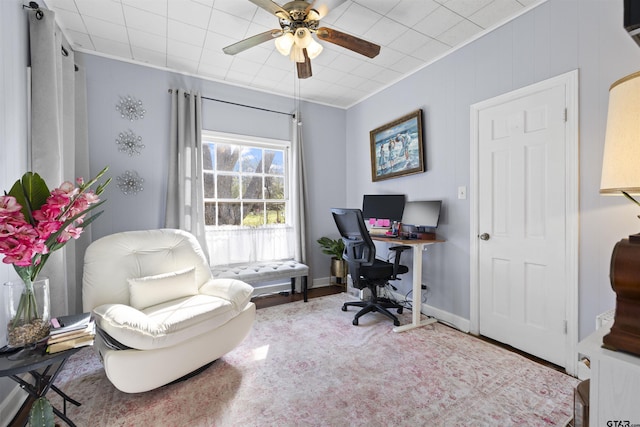 home office featuring baseboards and a ceiling fan