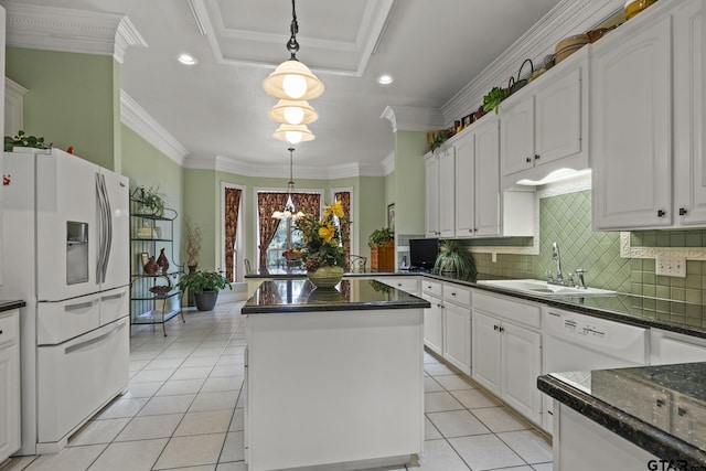 kitchen with sink, decorative light fixtures, white cabinetry, white appliances, and a center island