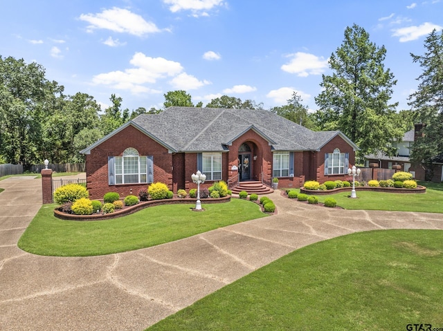 ranch-style home featuring a front yard