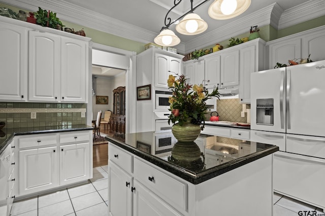 kitchen with a center island, decorative light fixtures, white cabinetry, and white appliances