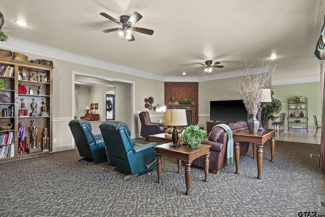 carpeted living room with ceiling fan and ornamental molding