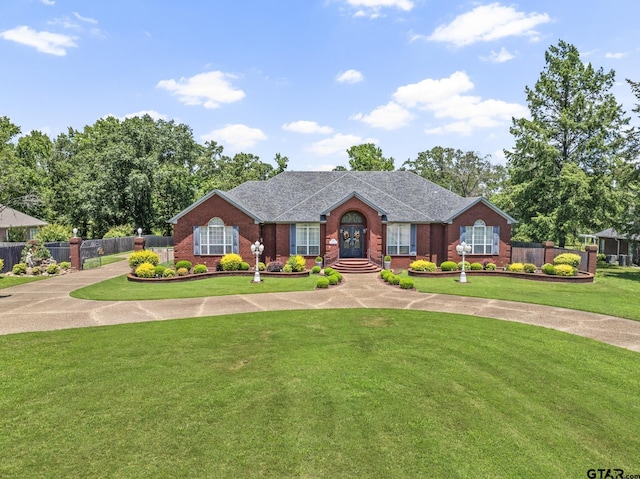 ranch-style home with a front lawn