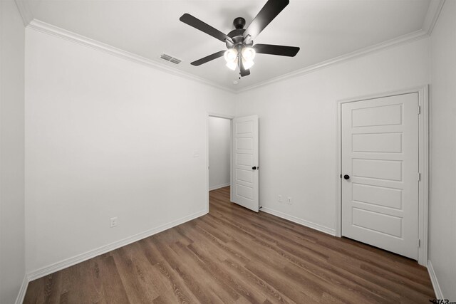 2716 Royal Village Way, Tyler, TX 75701 - unfurnished bedroom with wood finished floors, ornamental molding, baseboards, and ceiling fan