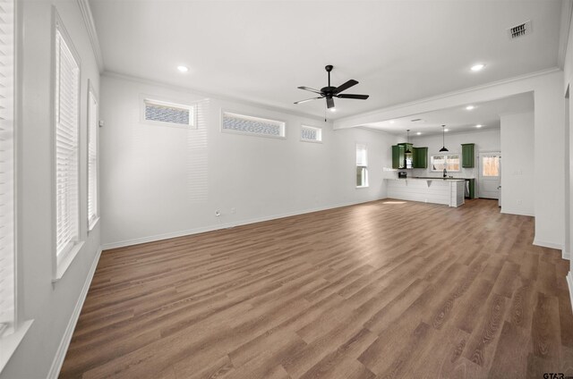 2716 Royal Village Way, Tyler, TX 75701 - unfurnished living room featuring a ceiling fan, ornamental molding, baseboards, wood finished floors, and recessed lighting