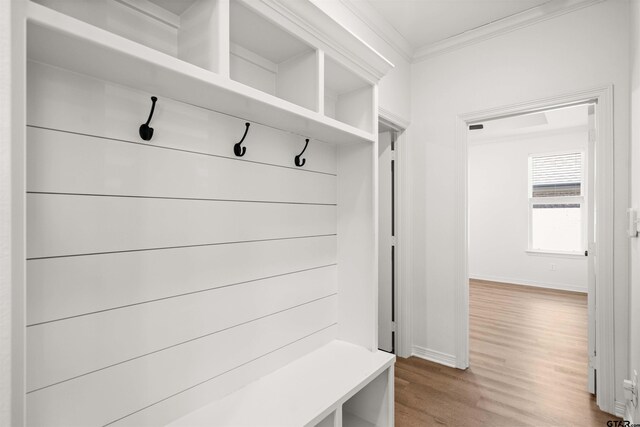 2716 Royal Village Way, Tyler, TX 75701 - mudroom featuring ornamental molding, baseboards, and wood finished floors