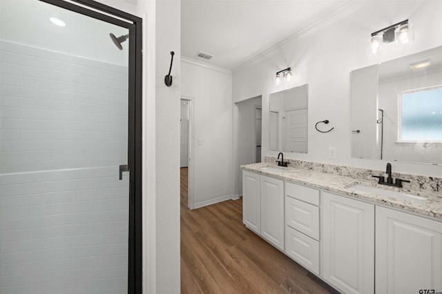 2716 Royal Village Way, Tyler, TX 75701 - full bath with ornamental molding, wood finished floors, double vanity, and a shower