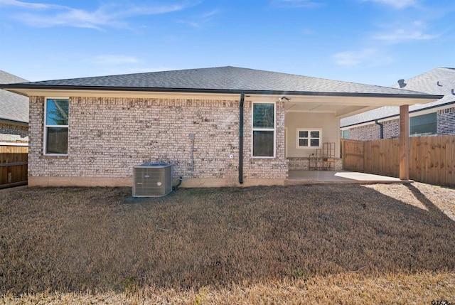 2716 Royal Village Way, Tyler, TX 75701 - back of property with a patio area, cooling unit, a shingled roof, and brick siding