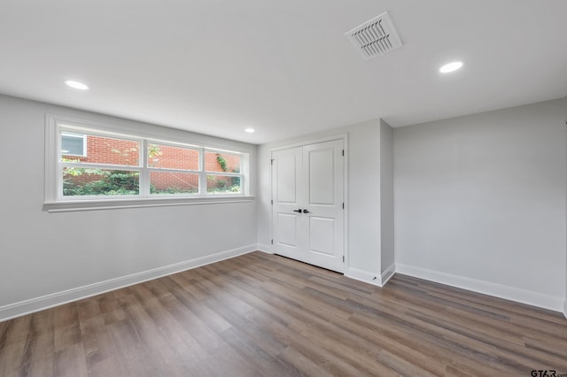 2918 Oak Knob Dr, Tyler, TX 75701 - unfurnished bedroom featuring wood finished floors, baseboards, recessed lighting, and a closet