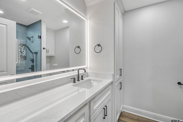 2918 Oak Knob Dr, Tyler, TX 75701 - full bath with vanity, a stall shower, baseboards, wood finished floors, and recessed lighting