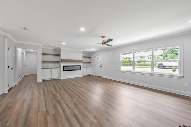 2918 Oak Knob Dr, Tyler, TX 75701 - unfurnished living room with recessed lighting, crown molding, ceiling fan, wood finished floors, and baseboards