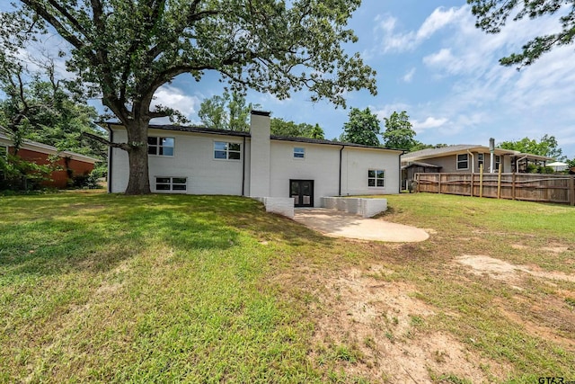2918 Oak Knob Dr, Tyler, TX 75701 - back of house featuring a chimney and a patio