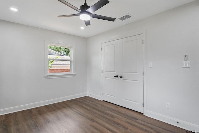 2918 Oak Knob Dr, Tyler, TX 75701 - unfurnished bedroom featuring dark wood finished floors, baseboards, recessed lighting, a closet, and a ceiling fan