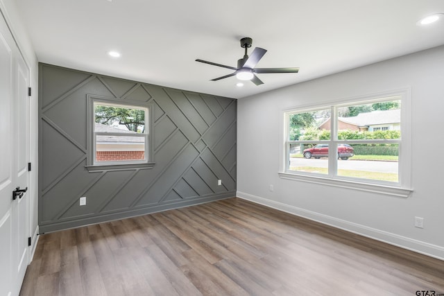 2918 Oak Knob Dr, Tyler, TX 75701 - spare room featuring plenty of natural light, baseboards, recessed lighting, and wood finished floors