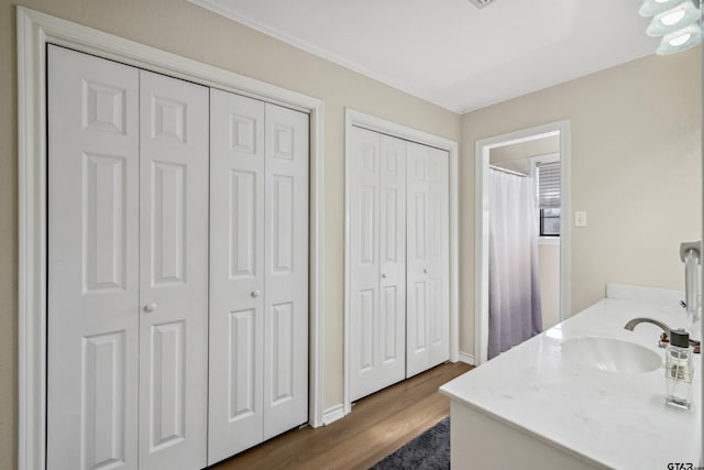 1039 Fm 2909, Canton, TX 75103 - bathroom with a closet, vanity, wood finished floors, and baseboards
