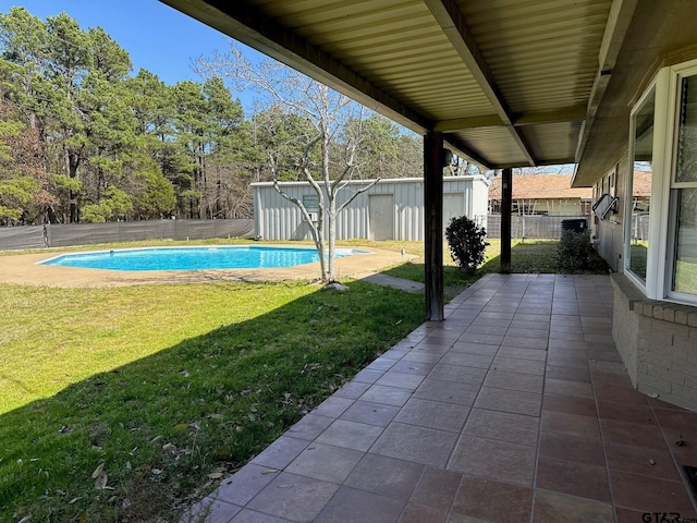 view of pool featuring a yard, a fenced in pool, a patio, and a fenced backyard