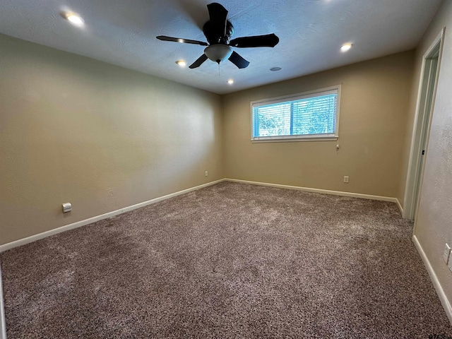 carpeted spare room featuring recessed lighting, baseboards, and ceiling fan