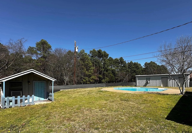 view of yard with an outdoor pool and fence