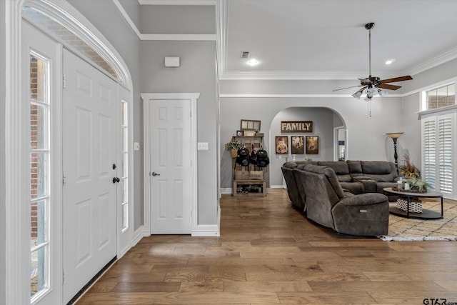 1807 Mill Creek Rd, Canton, TX 75103 - entryway with arched walkways, wood finished floors, ornamental molding, a ceiling fan, and baseboards