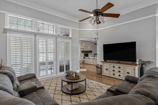 1807 Mill Creek Rd, Canton, TX 75103 - living area featuring a ceiling fan, wood finished floors, ornamental molding, a fireplace, and a high ceiling