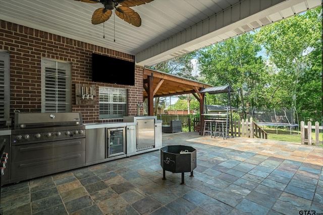 1807 Mill Creek Rd, Canton, TX 75103 - view of patio / terrace with a trampoline, a ceiling fan, and wine cooler