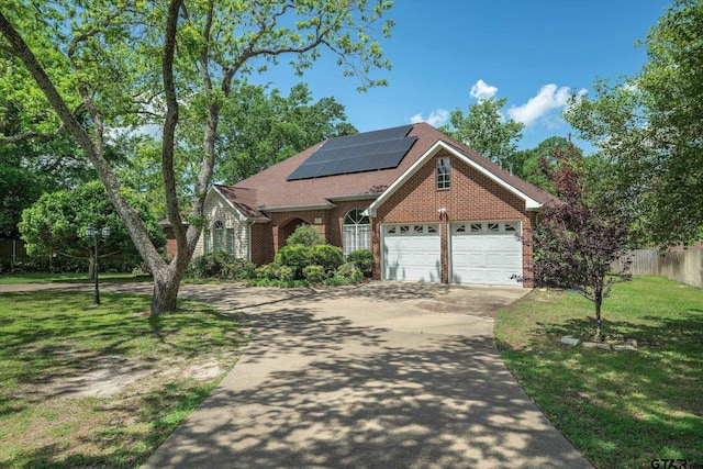 1807 Mill Creek Rd, Canton, TX 75103 - traditional-style house with driveway, brick siding, solar panels, and a shingled roof