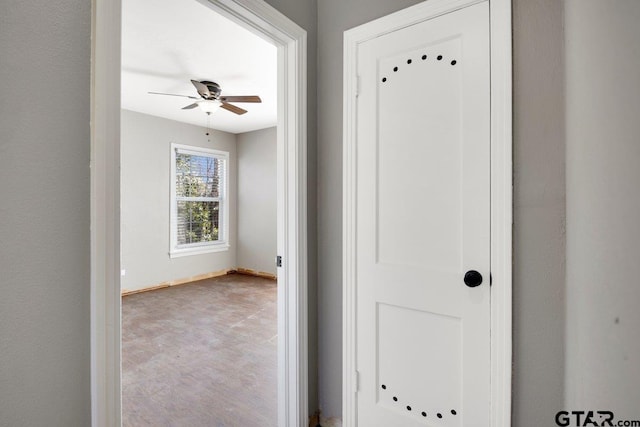 interior space featuring baseboards